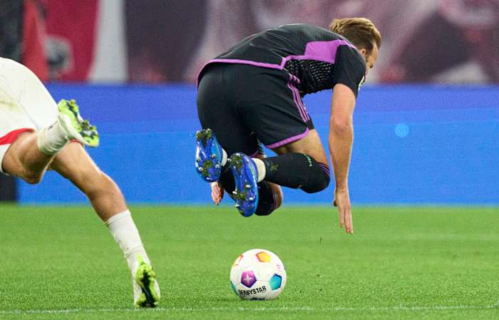 Harry Kane pictured falling over following a challenge with Xaver Schlager during Bayern Munich's 2-2 draw with RB Leipzig in September 2023